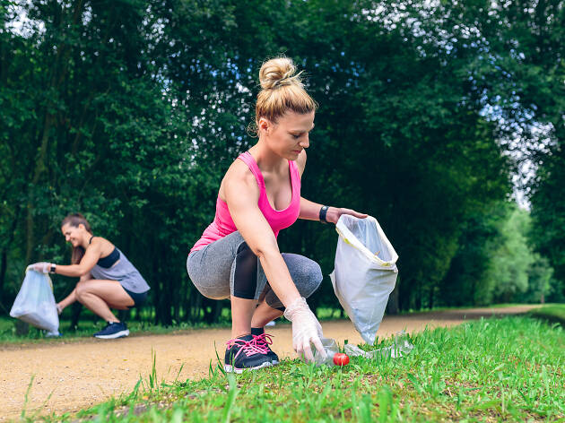 image of a person picking up thrash during their jog