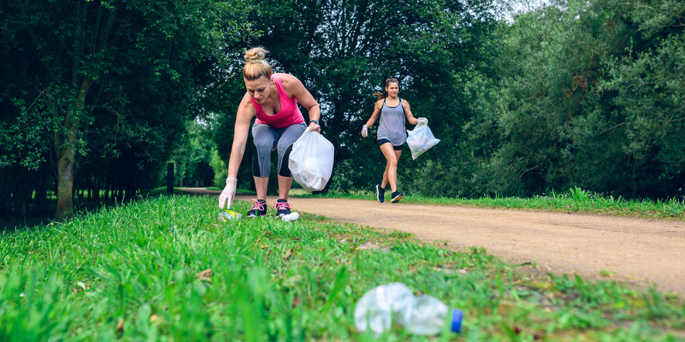 image of a person picking up thrash during their jog